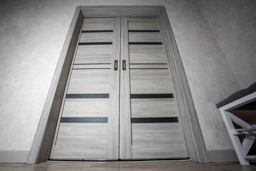 Modern gray interior sliding doors for the entrance to the hall, close-up
