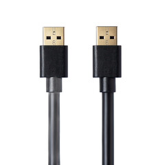 High-angle close-up view of two black USB-C cables with gold-colored connectors on a flat surface.