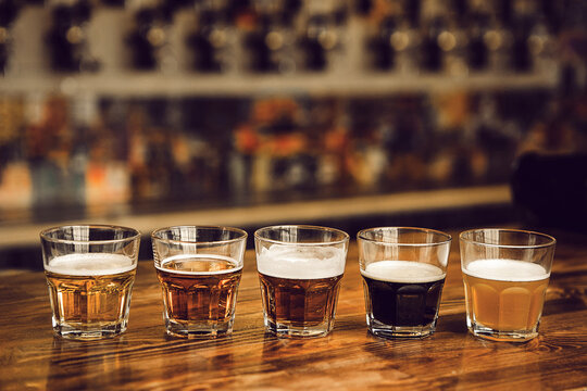 Exploring Five Unique Beer Varieties in Tasting Setup at Brewery