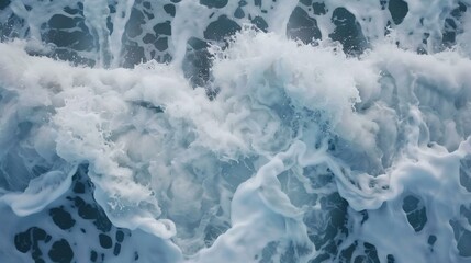 Obraz premium Foamy waves rolling on the ocean surface with dynamic motion, creating patterns of white and blue, a tranquil yet powerful sea scene