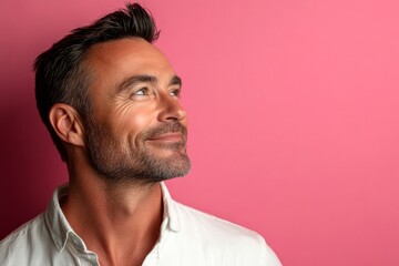 Obraz premium Fashionable men's quiff haircut - midlife white man with black hair. A graceful man with a warm and welcoming smile. Pink solid background. Visual idea drawing of style for aging men.