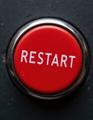 Bright Red Restart Button for Control Panel, Close-Up Image with Clear Text on Industrial Surface