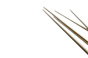 Needle Array: Sharp Metal Points Converging on White.