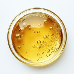 Clear, golden liquid in glass dish