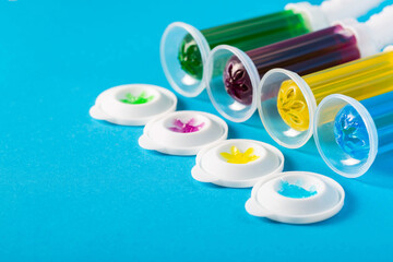 Set of multi-colored gel syringes with disinfectant and cleaner for cleaning the toilet bowl on a...