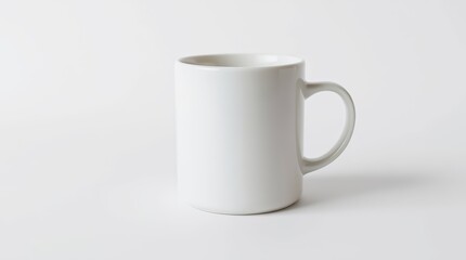Fototapeta premium Minimalist White Ceramic Mug on Clean Background – Product Mockup