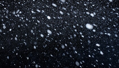 Falling snow on black background Winter background in pure dark Heavy snow