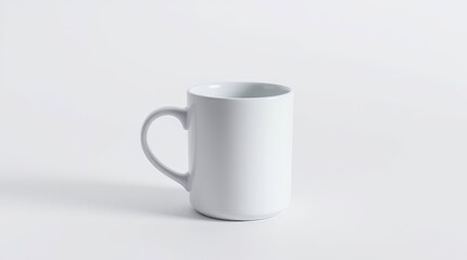 Obraz premium Minimalist White Ceramic Mug on Clean Background – Product Mockup