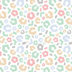 Simple pastel leopard skin print seamless pattern. Cheetah skin flat style background in retro boho colors. Hand drawn gender neutral pastel leopard print background. Cute and fun kids safari design.