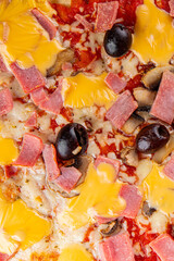 Pizza ham, mushrooms, olives, cheese appetizer vegetable dish fresh delicious gourmet food background on the table rustic food top view copy space