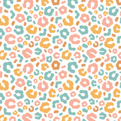 Simple pastel leopard skin print seamless pattern. Cheetah skin flat style background in retro boho colors. Hand drawn gender neutral pastel leopard print background. Cute and fun kids safari design.