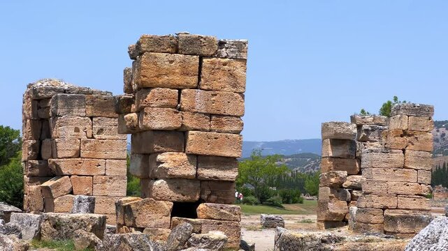 HIERAPOLIS in Denizli, TURKEY, August 13, 2024: The ancient city of Hierapolis near Pamukkale, against the backdrop of nature and mountains. The Phrygian period.UNESCO.4K