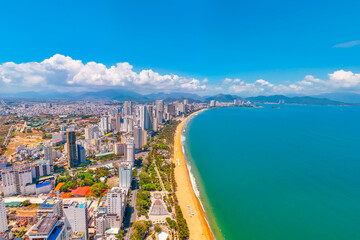 Obraz premium Beach overlooking aerial view city on the gold main resort coast of Southeast Asia in the hot sunny day Nha Trang