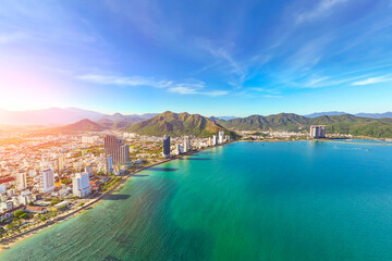 Fototapeta premium North beach overlooking aerial view city on the gold main resort coast of Southeast Asia in the hot sunny day Nha Trang