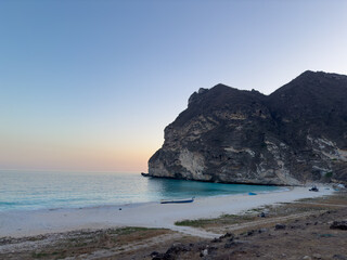 Afoul Beach view with lagoon at the end and very challenging access via canyon in dry riverbed, Salalah, Southern Oman
