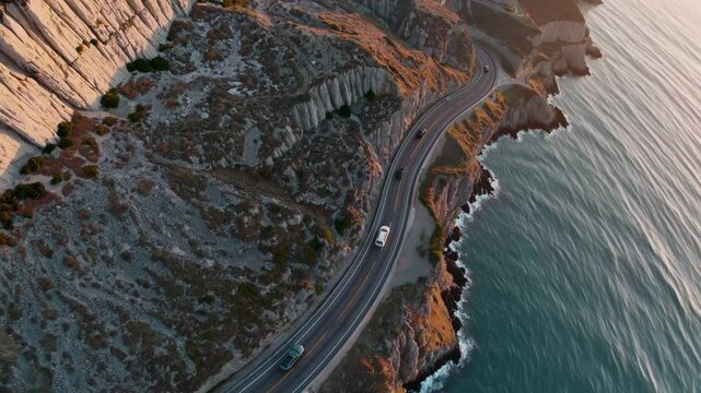 High vantage reveals sweeping cliff highway hugging ocean; cliff highway thrills road trippers, cliff highway unveils dramatic views, cliff highway merges awe with adventure. Concept epic route