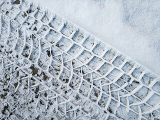 Tire tread prints on the ground. tire tracks. Tire tracks on a sandy road. Car tread prints on the...