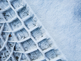 Tire tread prints on the ground. tire tracks. Tire tracks on a sandy road. Car tread prints on the sand. Footprint and traces of an off-road car tires in the mud. tire prints in the snow. © Taras