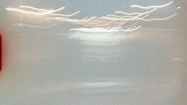 Abstract light trails forming dynamic patterns