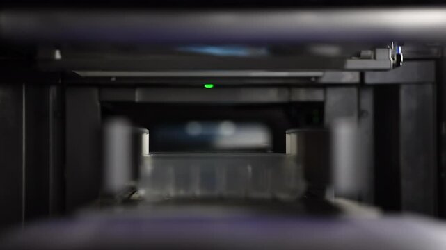 Narrow focus plastic tray is moved along thermoforming conveyor belt
