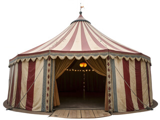 Colorful striped circus tent with open entrance and lit interior
