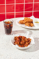 Diner cafe table served with fried chicken and soda water