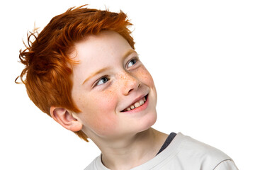Happy boy with red hair looking over his shoulder with a smile