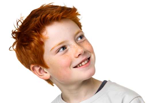 Happy boy with red hair looking over his shoulder with a smile