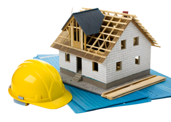 Model house under construction with a yellow hard hat and blueprints