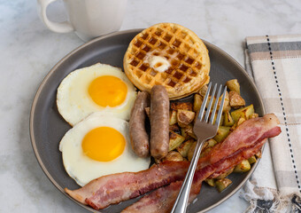 fried eggs with waffles  top with melted butter and  syrup