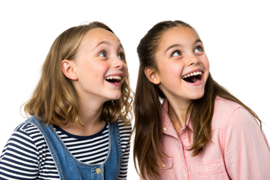 Two girls with joyful expressions looking upwards in excitement