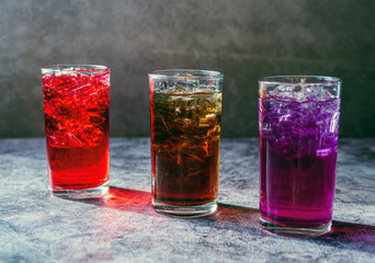A lot of Soft drinks in colorful and flavorful glasses on the table,Glasses with sweet drinks with...