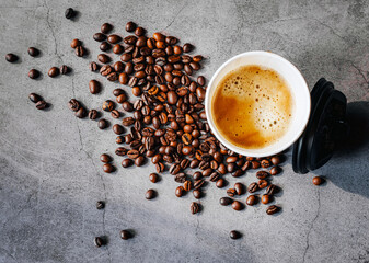 Coffee crema espresso in paper Coffee cup and bean on gray background, Top view of Espresso in  Takeaway paper coffee cup.