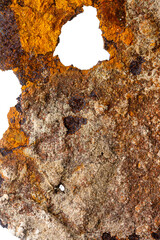 Close up of old piece of rusty iron isolated on white background. Rusty metal surface. Very old piece of sheet metal, rusted through, with holes and ragged edges.