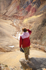 girl looking at red hills