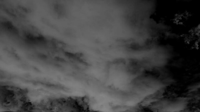 A mesmerizing time-lapse video capturing clouds drifting across the sky, creating a cinematic and surreal atmosphere.