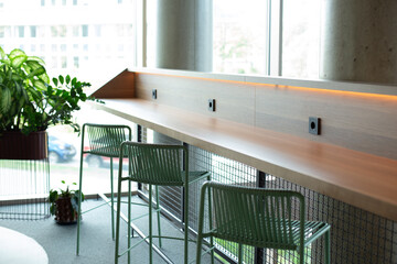 Fototapeta premium Modern cafe interior with window counter seating and minimalist design