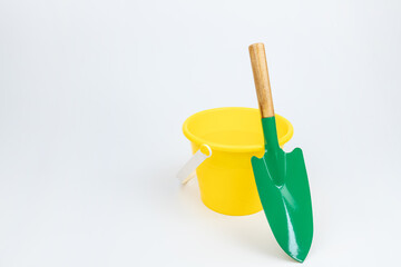 The bucket and shovel on the white background
