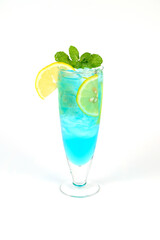 Mojito cocktail in a glass with mint lime and ice on a white background