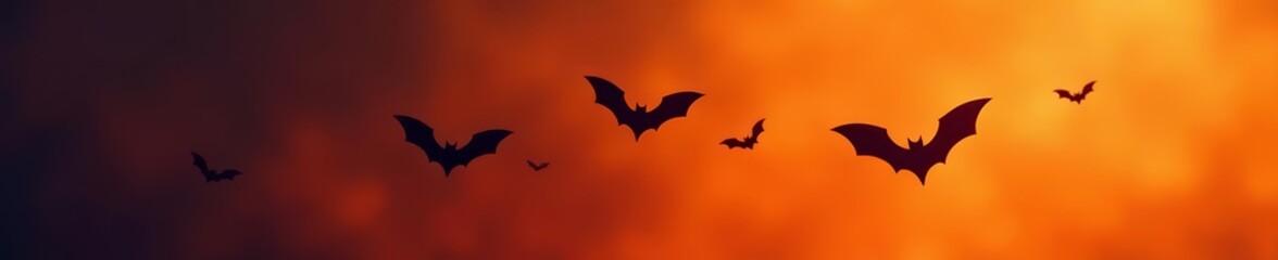 Fototapeta premium Flock of bats flying in formation, Halloween silhouette, night, creepy