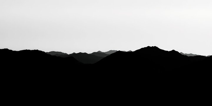 Grungy halftone mountain range silhouette, black textured landscape with fading grainy hills , rock, empty space