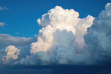 Massive cumulonimbus clouds dominate a turbulent sky , blue, atmospheric