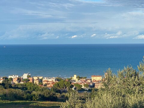 Panoramic view of Silvi Marina with its buildings and the Adriatic Sea, surrounded by lush vegetation, in the province of Teramo