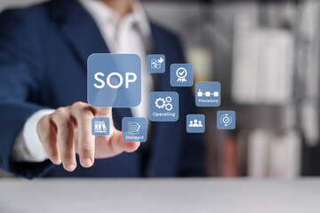 SOP, Standard operating procedure concept. Businessman touching SOP icons on virtual screen....