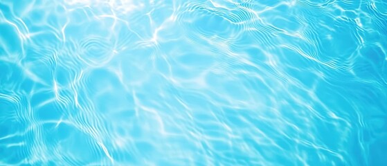 Obraz premium A tranquil blue water surface reflecting light with gentle ripples, creating a serene and calming atmosphere.