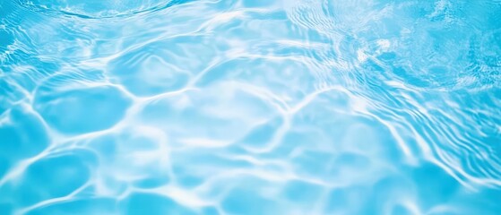 Obraz premium A tranquil image of shimmering blue water, capturing the gentle ripples and reflections on the surface.