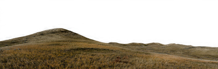 Panorama of rolling hills and autumn colored prairie grass with a transparent sky