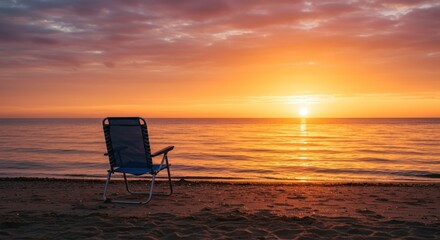 Beach chair on the beach at sunset, photo