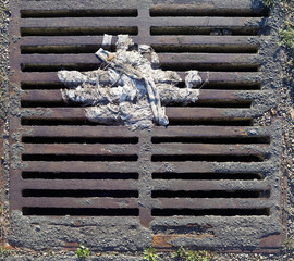 Sewer grate accumulating debris