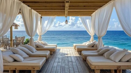 Oceanfront wooden deck lounge area with white drapes,  beach bar in background